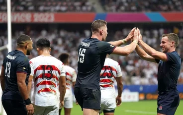 England celebrating victory over Japan at the Rugby World Cup