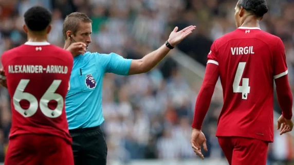 Liverpool's Virgil van Dijk charged after refusing to leave the pitch following red card