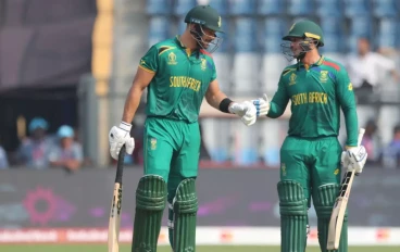 Aiden Markram of South Africa and Quinton de Kock of South Africa interact during the ICC Men's Cricket World Cup 2023 match between South Africa and Bangladesh at Wankhede Stadium on October