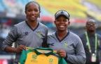 Ayabonga Khaka of South Africa poses for a picture with team mate Sinalo Jafta after presenting her with a shirt to mark her 50th T20 International appearance for South Africa ahead of the IC