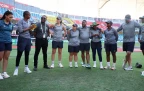 Ayabonga Khaka of South Africa presents team mate Sinalo Jafta with a shirt to mark her 50th T20 International appearance for South Africa ahead of the ICC Women's T20 World Cup 2024 match be