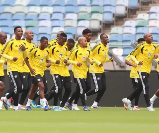 Bafana Bafana players warm up at Moses Mbhida Stadium