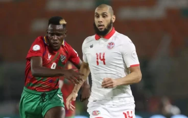 Aissa Laïdouni of Tunisia battles with Bethuel Muzeu of Namibia during the TotalEnergies CAF Africa Cup of Nations group stage match between Tunisia and Namibia at Amadou Gon Coulibaly Stadiu