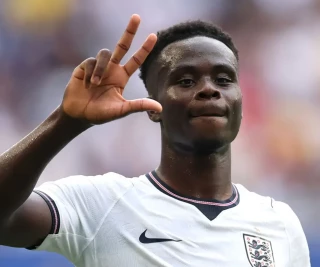 Bukayo Saka #7 of England celebrates after scoring his team's fifth and hat trick goal during the FIFA World Cup 2026 Bronze Final between France and England at Miami Stadium on July 18, 2026