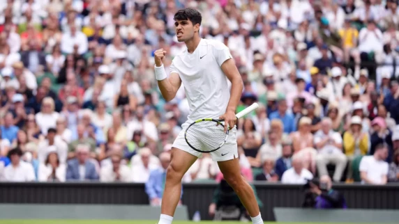 Carlos Alcaraz starts Wimbledon title defence with straight-sets victory on Centre Court