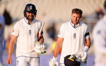 chris-woakes-(left)-and-joe-root-for-england-aug-202416