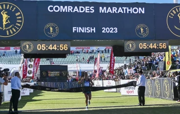 2023 Comrades Marathon winner cross finish line