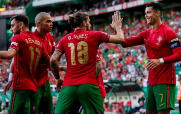Cristiano Ronaldo of Portugal celebrates with teammate Ruben Neves