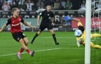 florian-wirtz-of-bayer-leverkusen-scores-the-winning-goal16.webp