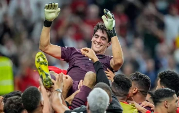 goalkeeper Yassine Bounou of Morocco celebrates after winning with his team mates after the FIFA World Cup Qatar 2022 Round of 16