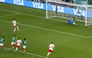 Guillermo Ochoa saving a Robert Lewandowski penalty