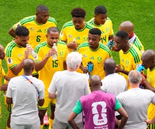 Hugo Broos with Bafana Bafana players