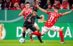 jamal-musiala-of-bayern-munich-gets-past-dominik-kohr-of-mainz16.webp