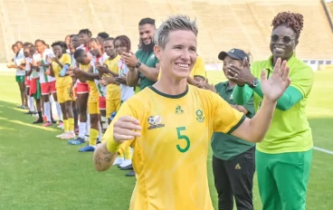 Janine Van Wyk of South Africa is presented with a special plaqe after finishing her career on a 185 matches by SAFA President Dannie Jordaan during the 2024 WAFCON Qualifier, 2nd Leg match b