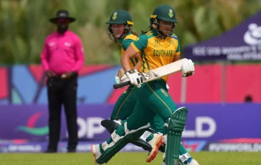 Jemma Botha (R) and Simone Lourens (L) of South Africa takes a single during the ICC U19 Women's T20 World Cup match between South Africa and Nigeria at Borneo Cricket Ground on January 22, 2