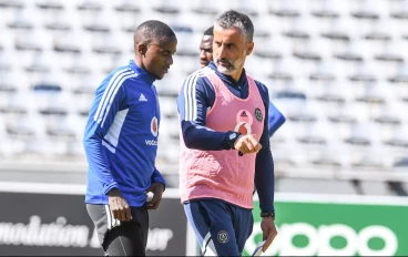 Orlando Pirates coach Jose Riveiro has a chat with Thembinkosi Lorch during training