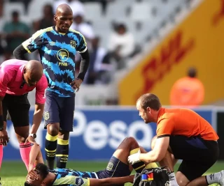 Keanu Cupido of Cape Town City receives treatment for an injury during the DStv Premiership match between Cape Town City FC and Orlando Pirates at DHL Cape Town Stadium on May 01, 2024 in Cap