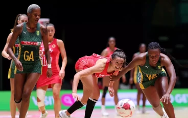 Khanyisa Chawane of South Africa battles for the ball with Beth Cobden of England during the Vitality Netball Nations Cup match between England Vitality Roses and South Africa at Motorpoint A