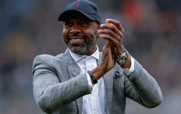 Leeds United Legend Lucas Radebe claps the fans