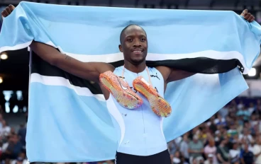 Letsile Tebogo of Team Botswana celebrates winning the gold medal after competing in the Men's 200m Final on day thirteen of the Olympic Games Paris 2024 at Stade de France on August 08, 2024