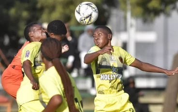 Lindelani Ladies players challenge for an aerial ball