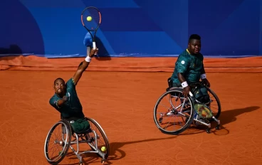 Lucas Sithole of South Africa (L) and Donald Ramphadi of South Africa in action against Sam Schroder of the Netherlands and Niels Vink of the Netherlands in the Men's Quad Wheelchair Tennis D