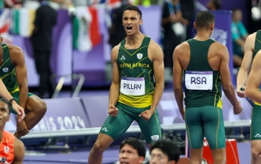 Lythe Pillay of South Africa reacts after seeing that he and his teammates have set a new South African record in the final of the mens 4x400m relay during the evening session of athletics on