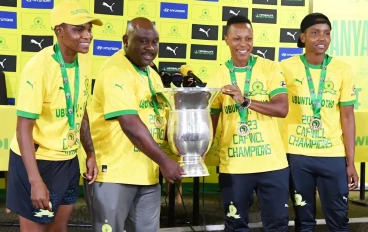 Mamelodi Sundowns Ladies coach Jerry Tshabalala with players during the Mamelodi Sundowns Ladies team arrival and welcome at OR Tambo International Airport on November 21, 2023 in Johannesbur