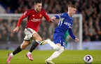 manchester-uniteds-diogo-dalot-and-chelseas-cole-palmer-battle-for-the-ball.webp