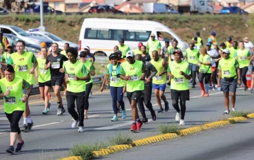 21 km and 10 km runners merge at the Soweto Highway towards FNB stadium during the 2022 Soweto Marathon on November 06, 2022 in Soweto, South Africa.