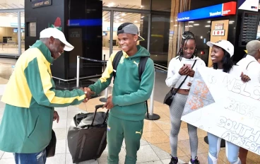 Michael Seme welcomes athletes during the South Africa national road running team arrival at OR Tambo International Airport on October 03, 2023 in Johannesburg, South Africa.