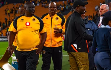 Kaizer Chiefs coach Molefi Ntseki escorted by police after fans throwing objects on him during the Carling Knockout match between Kaizer Chiefs and AmaZulu FC at FNB Stadium on October 21, 20
