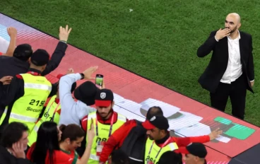 Walid Regragui, Head Coach of Morocco, applauds fans after the team's 1-0 victory