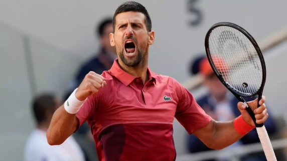 Novak Djokovic survives five-set thriller to march on to French Open quarters