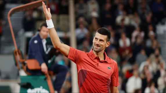 Novak Djokovic shrugs off boos to march into French Open third round