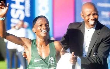 Onalenna Khonkhobe Elite Male winner during the 2024 Totalsports Two Oceans Ultra Marathon finishing at UCT Rugby Fields on April 13, 2024 in Cape Town, South Africa.