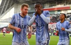 pape-matar-sarr-of-tottenham-hotspur-celebrate-with-dejan-kulusevski-after-scoring16.webp