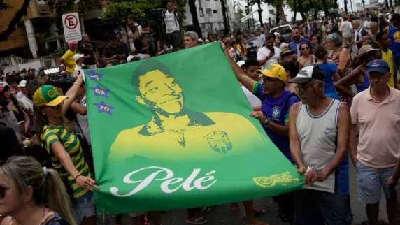 Thousands line streets to bid final farewell to Brazil great Pele