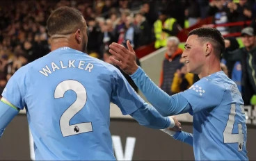 Phil Foden celebrates with Kyle Walker