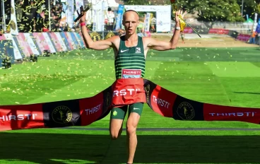 Piet Wiersma wins the mens 2024 Comrades Marathon race during the Comrades Marathon finishing at Hollywoodbets Scottsville Racecourse on June 09, 2024 in Pietermaritzburg, South Africa.