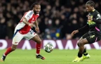 raheem-sterling-of-arsenal-challenges-with-tyrell-malacia-of-psv-eindhoven16.webp