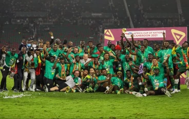 Senegal players celebrate with the trophy after winning the 2021 Africa Cup of Nations final