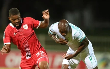 Etiosa Ighodaro of AmaZulu FC and Sipho Mbule of Sekhukhune United during the Betway Premiership match between Sekhukhune United and AmaZulu FC at Peter Mokaba Stadium on February 19, 2025 in