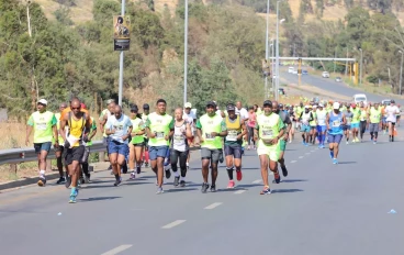 21 km and 10 km runners merge at the Soweto Highway towards FNB stadium during the 2022 Soweto Marathon on November 06, 2022 in Soweto, South Africa.