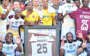 Stellenbosch FC players and fans pose with the jersey of Oshwin Andries during the Nedbank Cup, Last 32 match between Stellenbosch FC and Swallows FC at Athlone Stadium on February 11, 2023 i