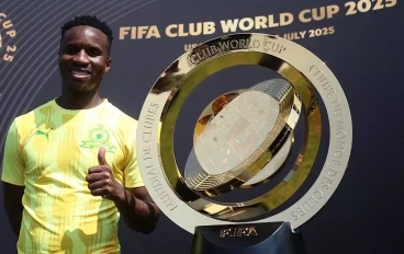 Mamelodi Sundowns midfielder Themba Zwane alongside the new FIFA Club World Cup trophy