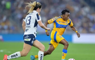 Thembi Kgatlana of Tigres UANL femenil drives the ball while followed by Karol Bernal of Monterrey femenil during the Final second-leg match between Monterrey and Tigres UANL as part of the T