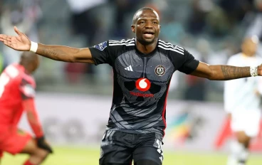 Tshegofatso Mabasa of Orlando Pirates scores his goal against Sifiso Mlungwana of Golden Arrows during the DStv Premiership match between Orlando Pirates and Golden Arrows at Orlando Stadium