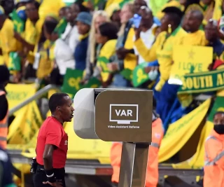 CAF referee during a VAR review