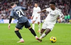 vinicius-junior-of-real-madrid-and-adrian-embarba-of-rayo-vallecano-in-action16.webp